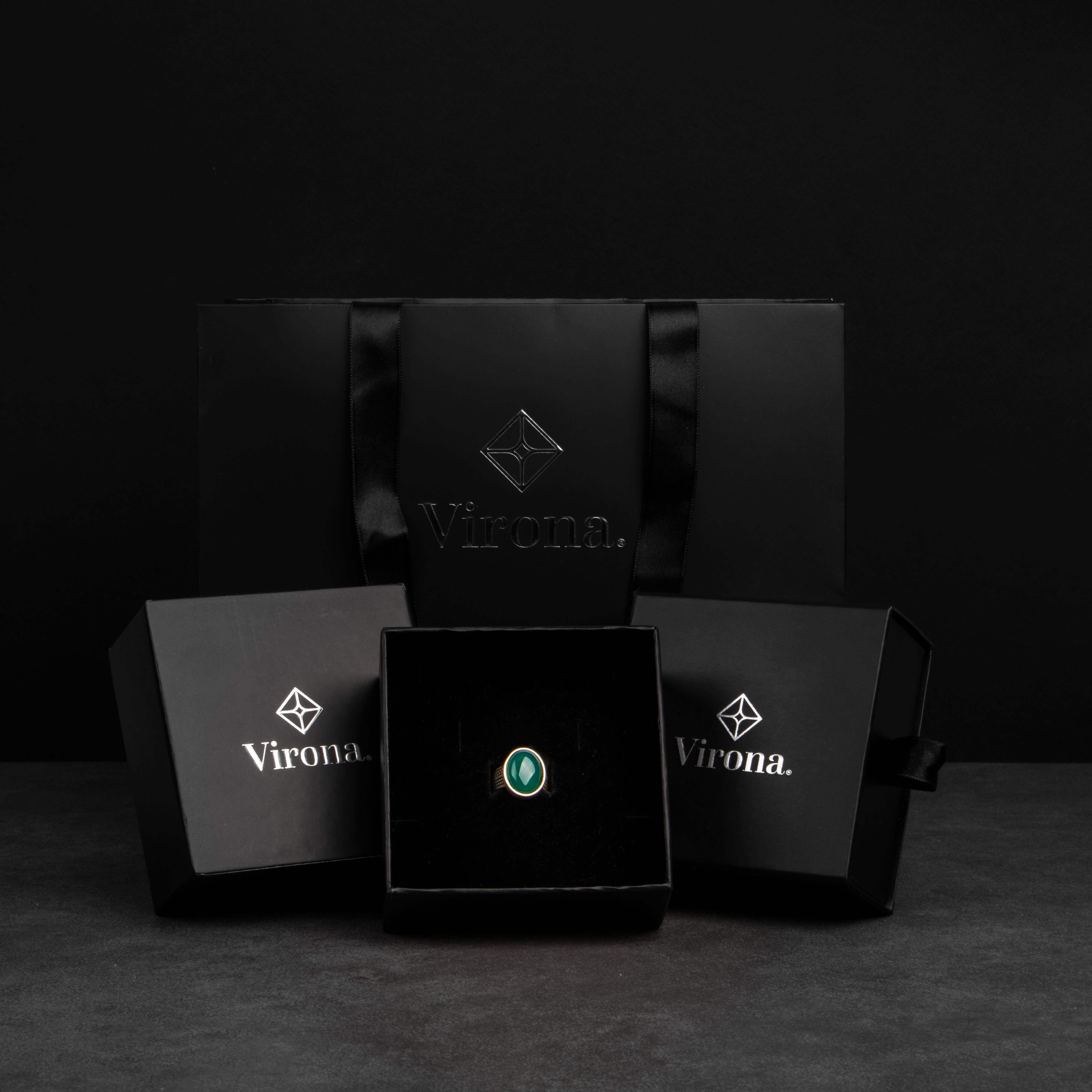 Men's silver ring decorated with green agate stone