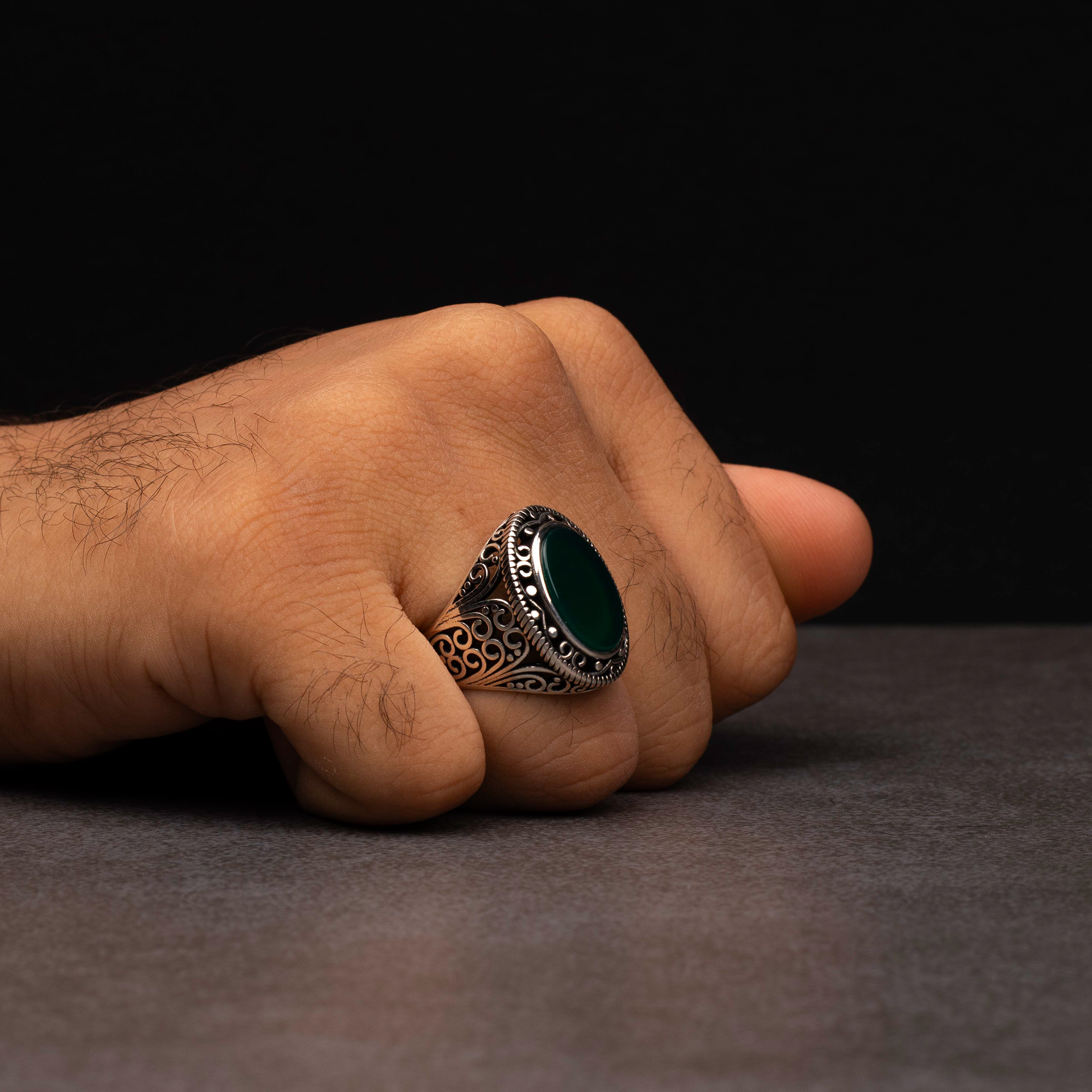 Men's silver ring decorated with green agate stone