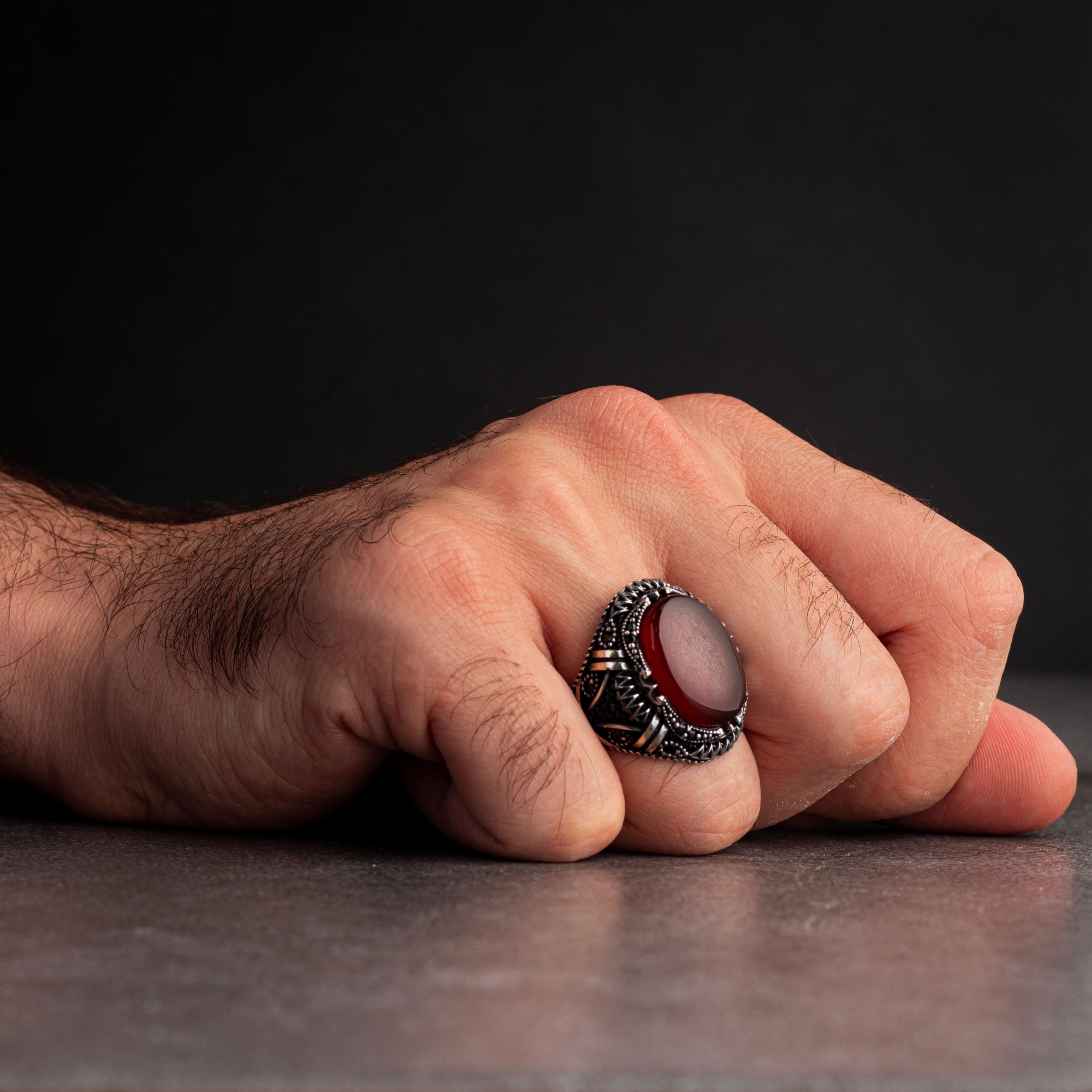 Men's silver ring decorated with a red agate stone