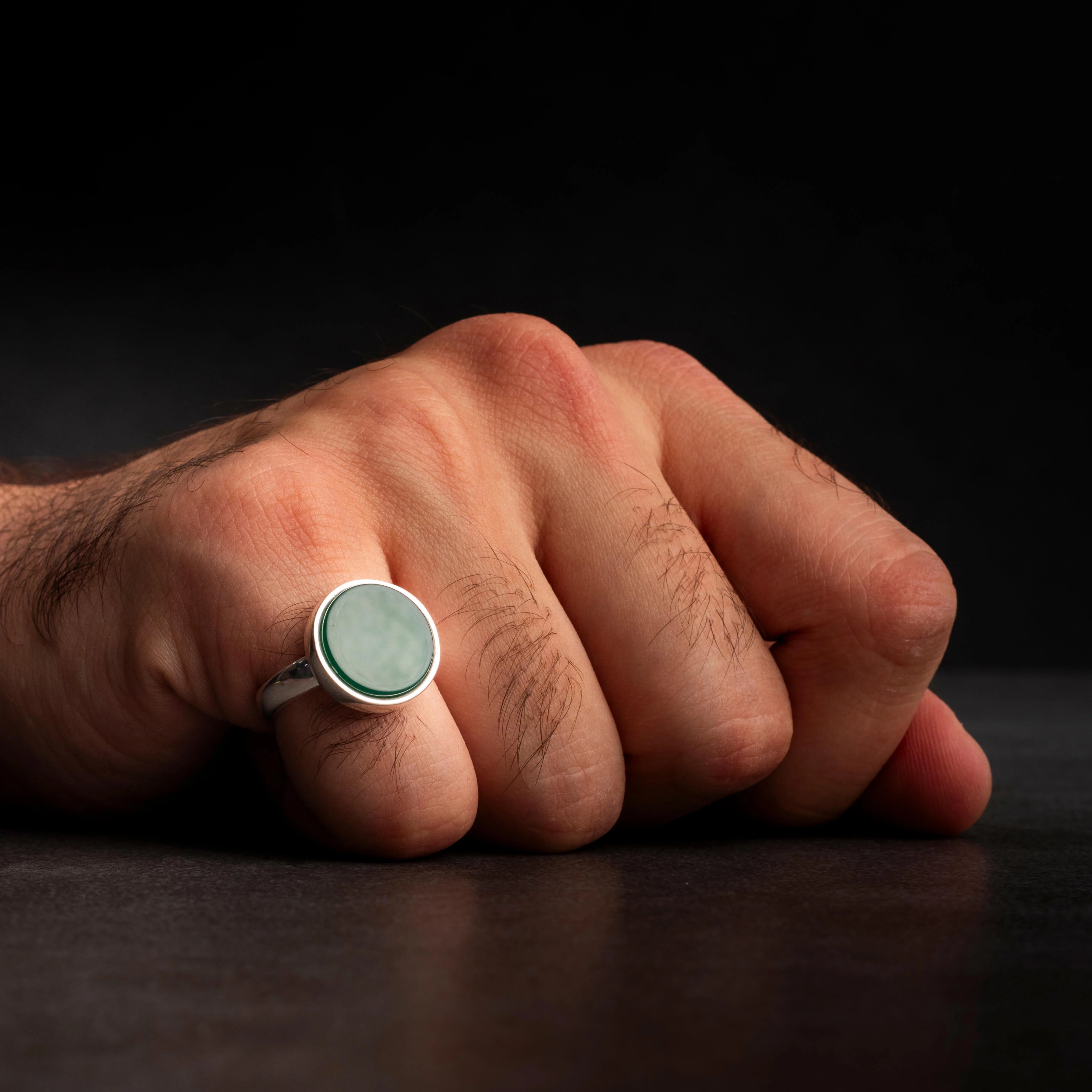 Men's silver ring decorated with green agate stone