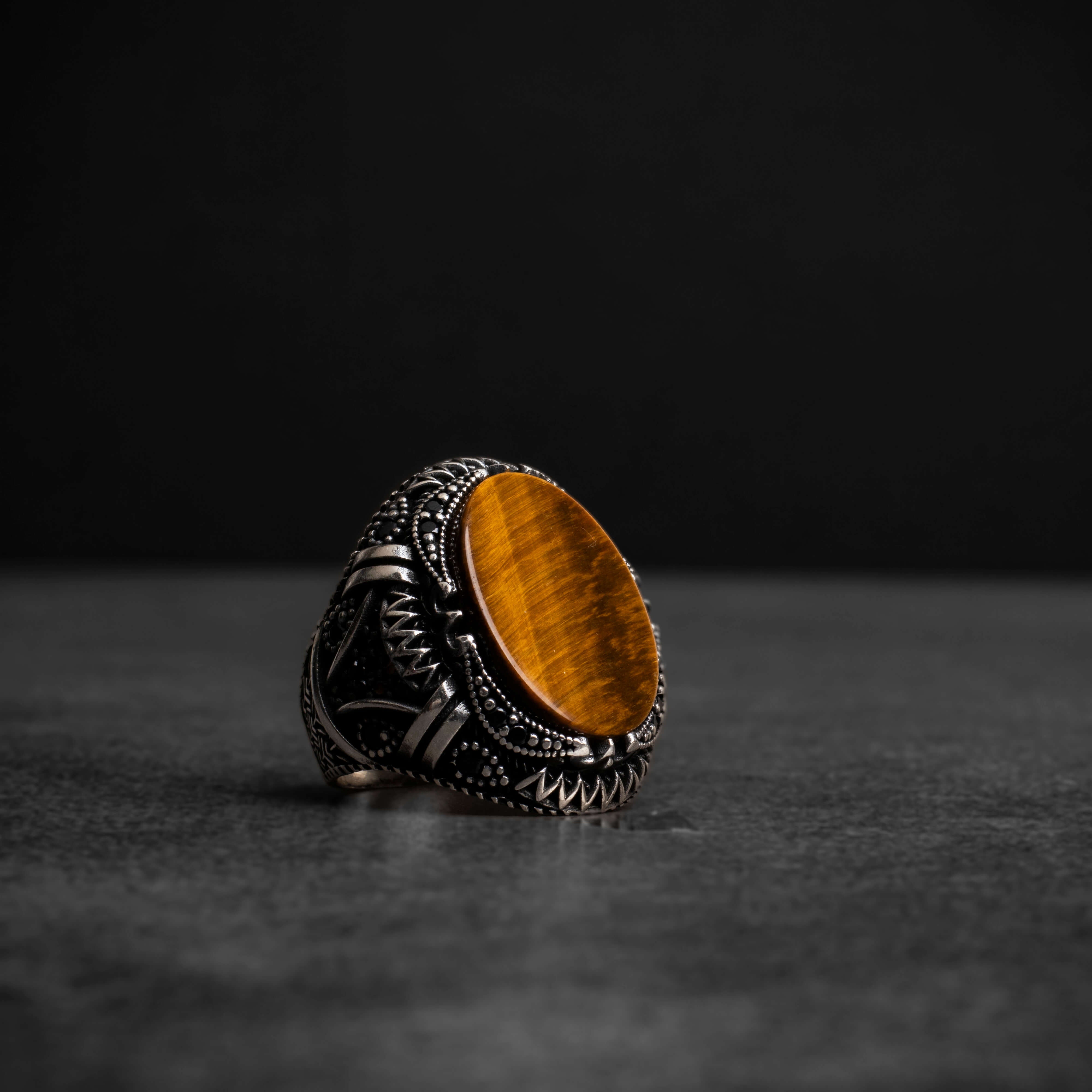 Men's silver ring with tiger's eye stone and prominent geometric details