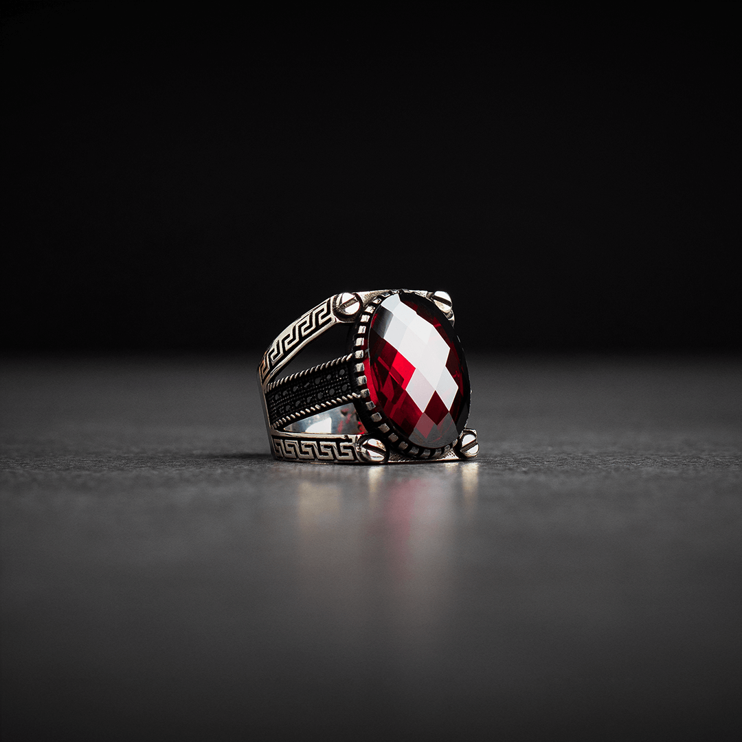 Men's silver ring decorated with red zircon stone