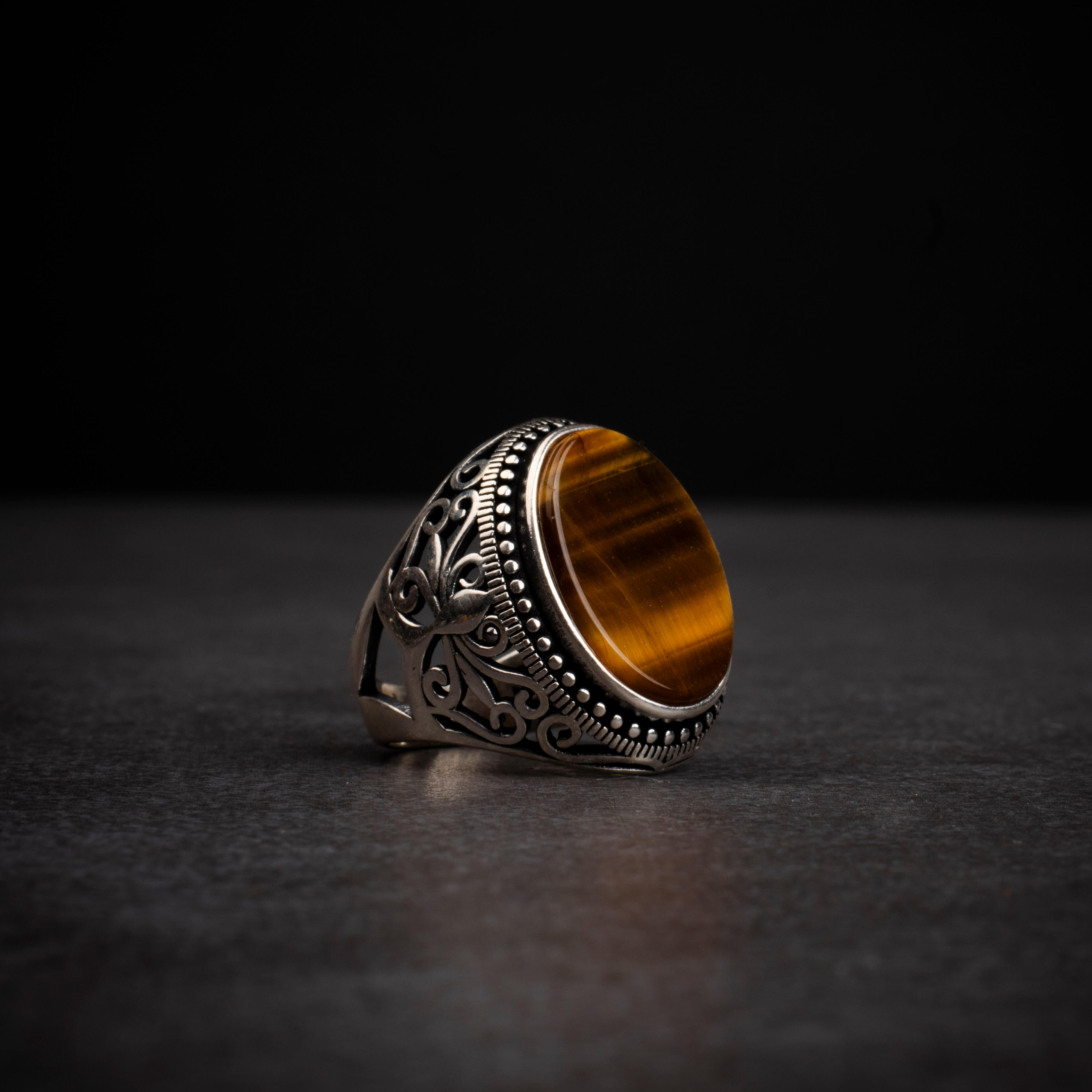 Men's silver ring with tiger eye stone and ornamental design