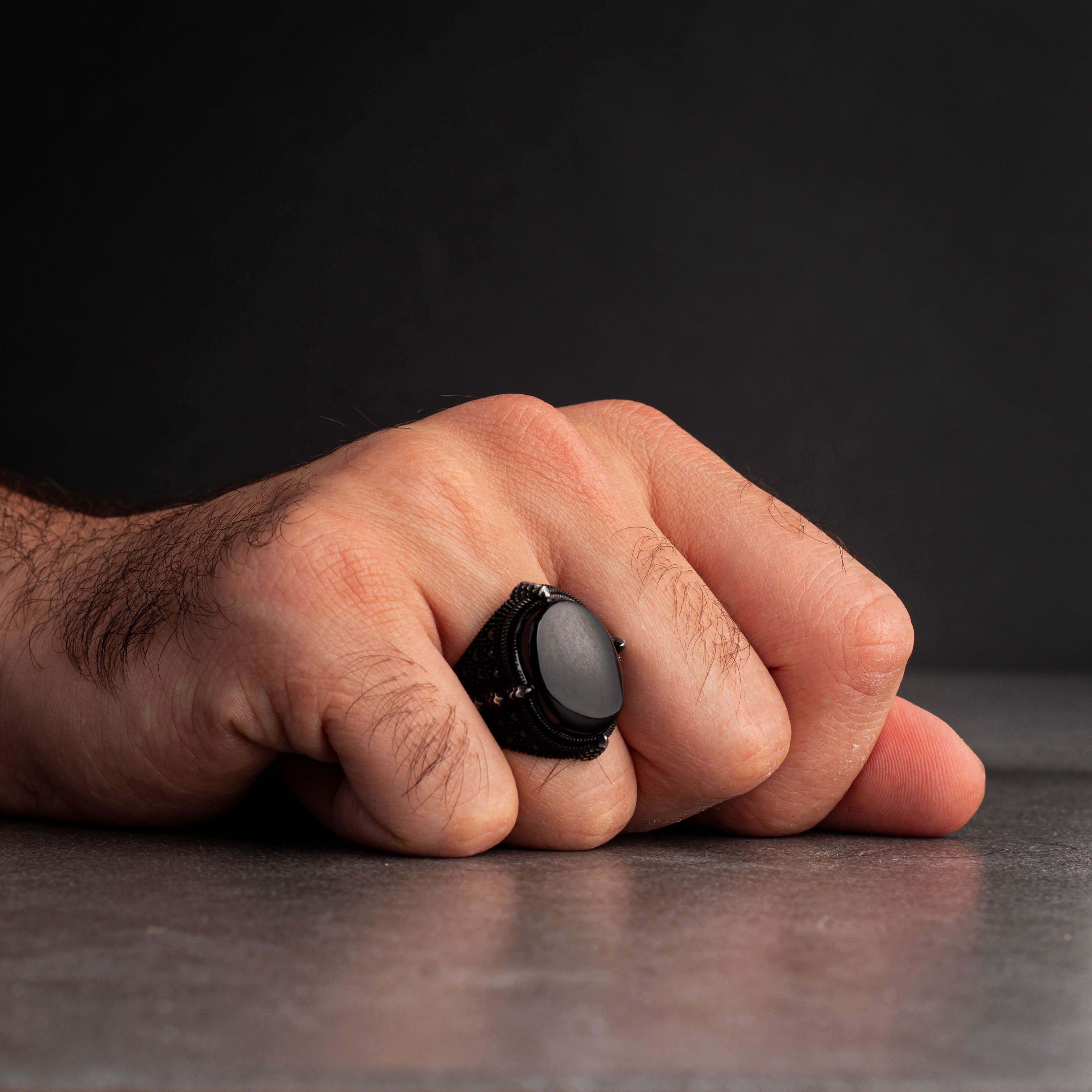 Men's silver ring decorated with a black onyx stone