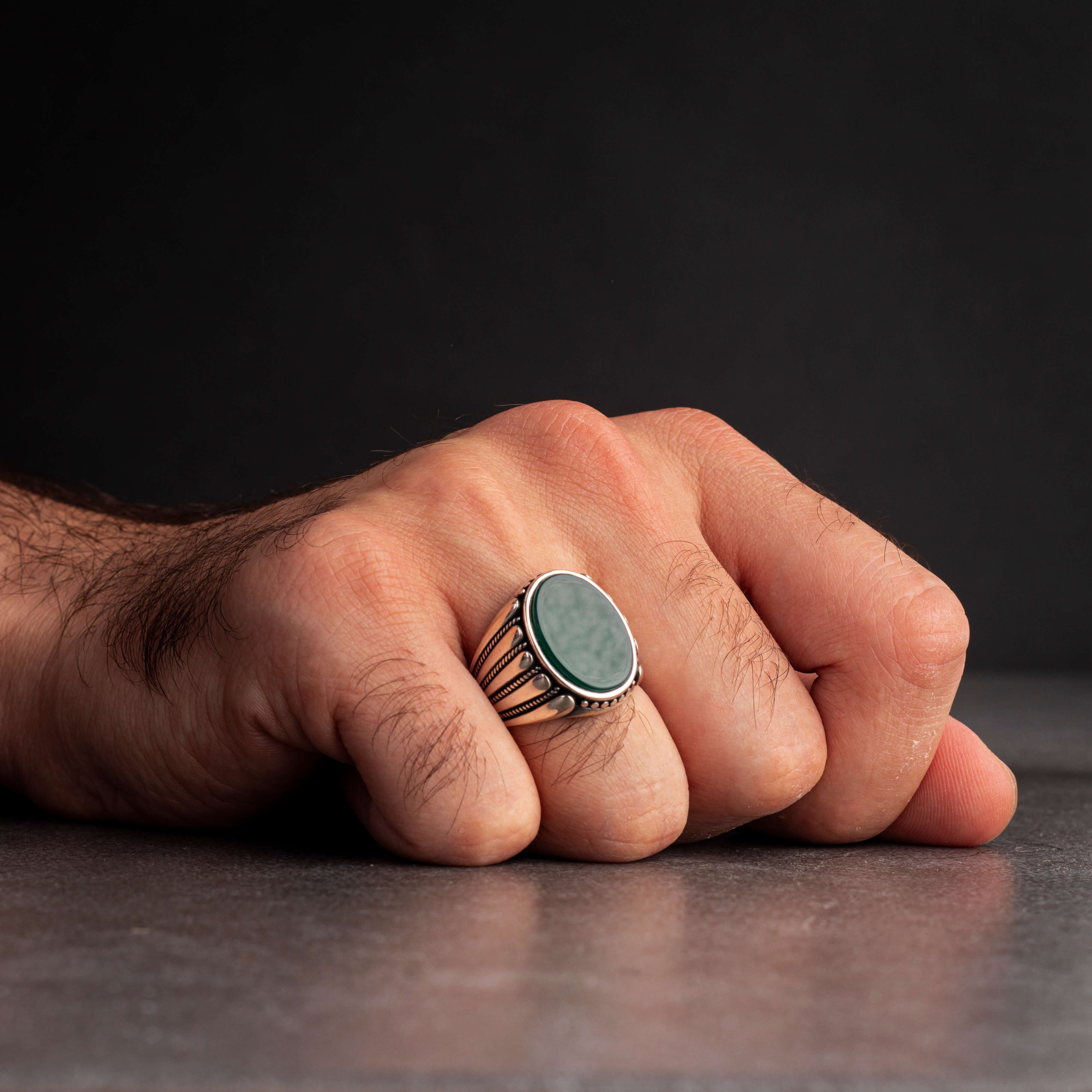 Men's silver ring decorated with green agate stone