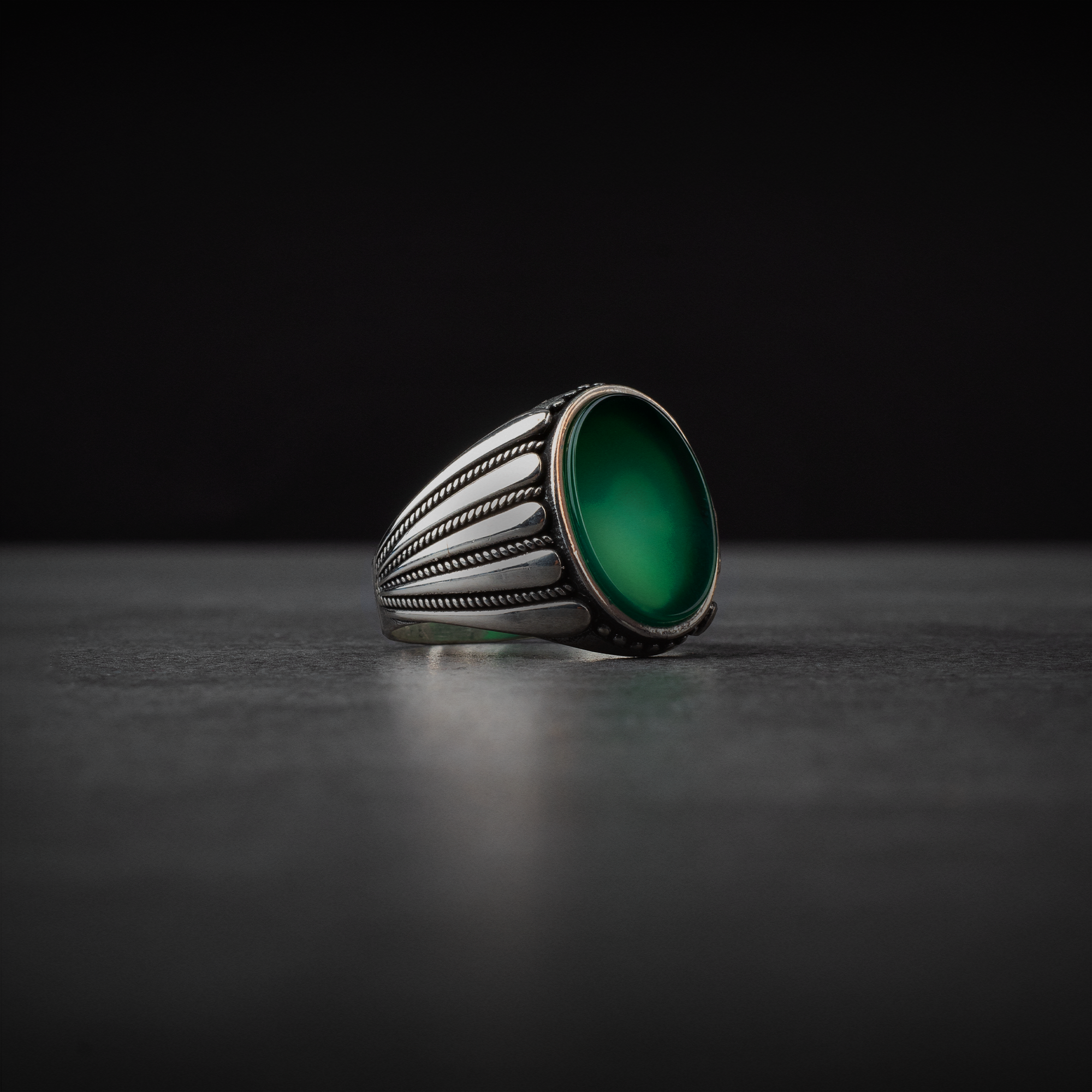Men's silver ring decorated with green agate stone