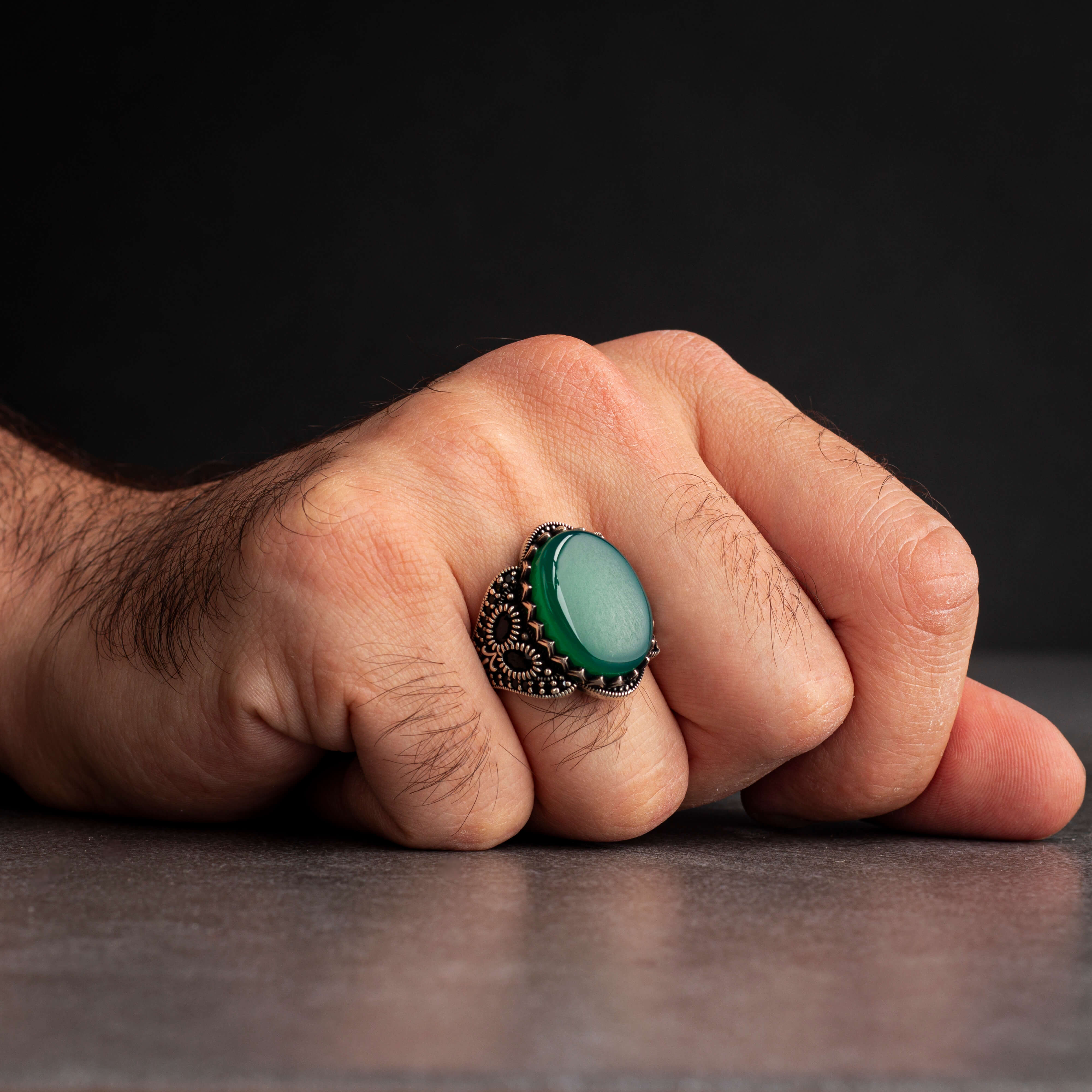 Men's silver ring decorated with green agate stone