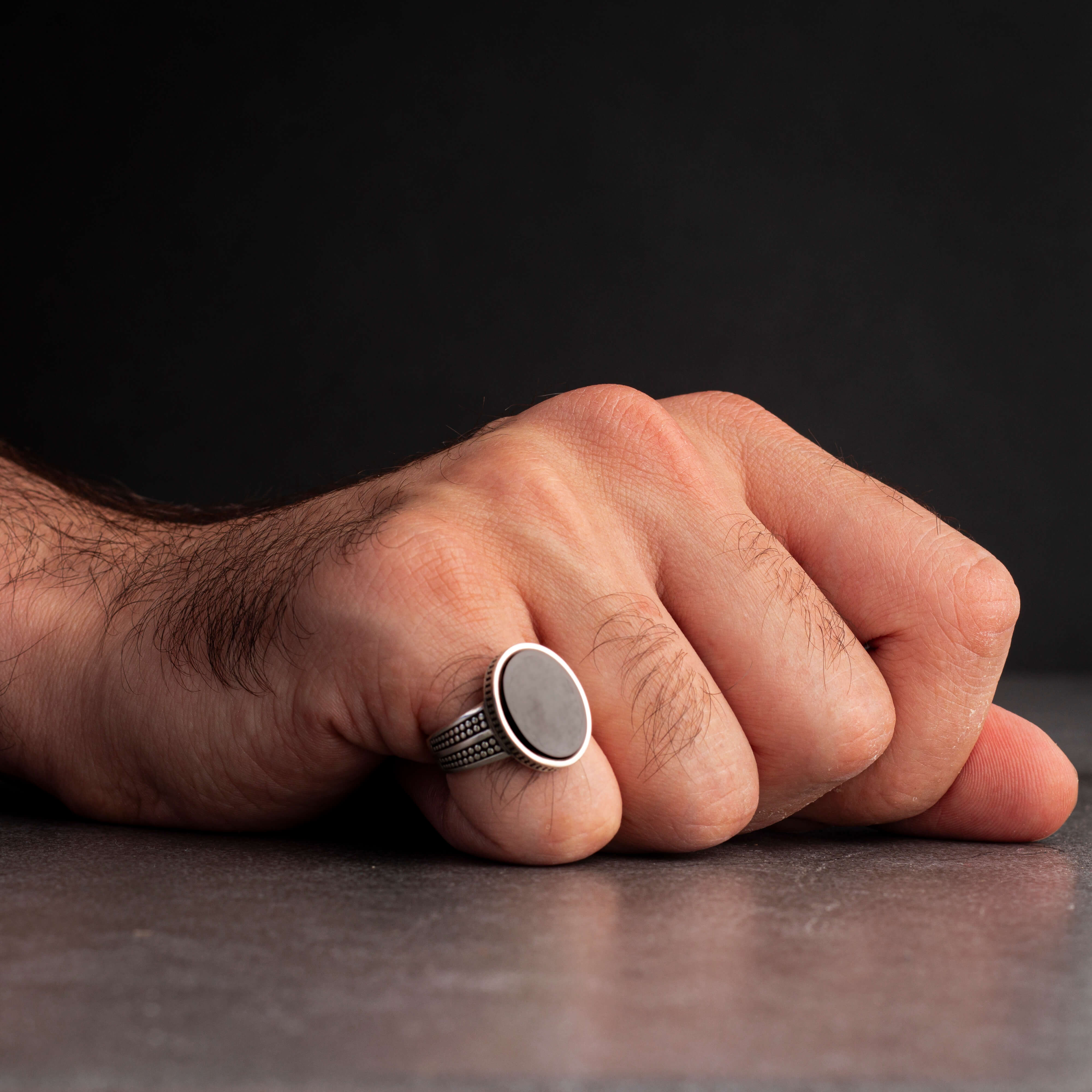 Men's silver ring decorated with black onyx stone