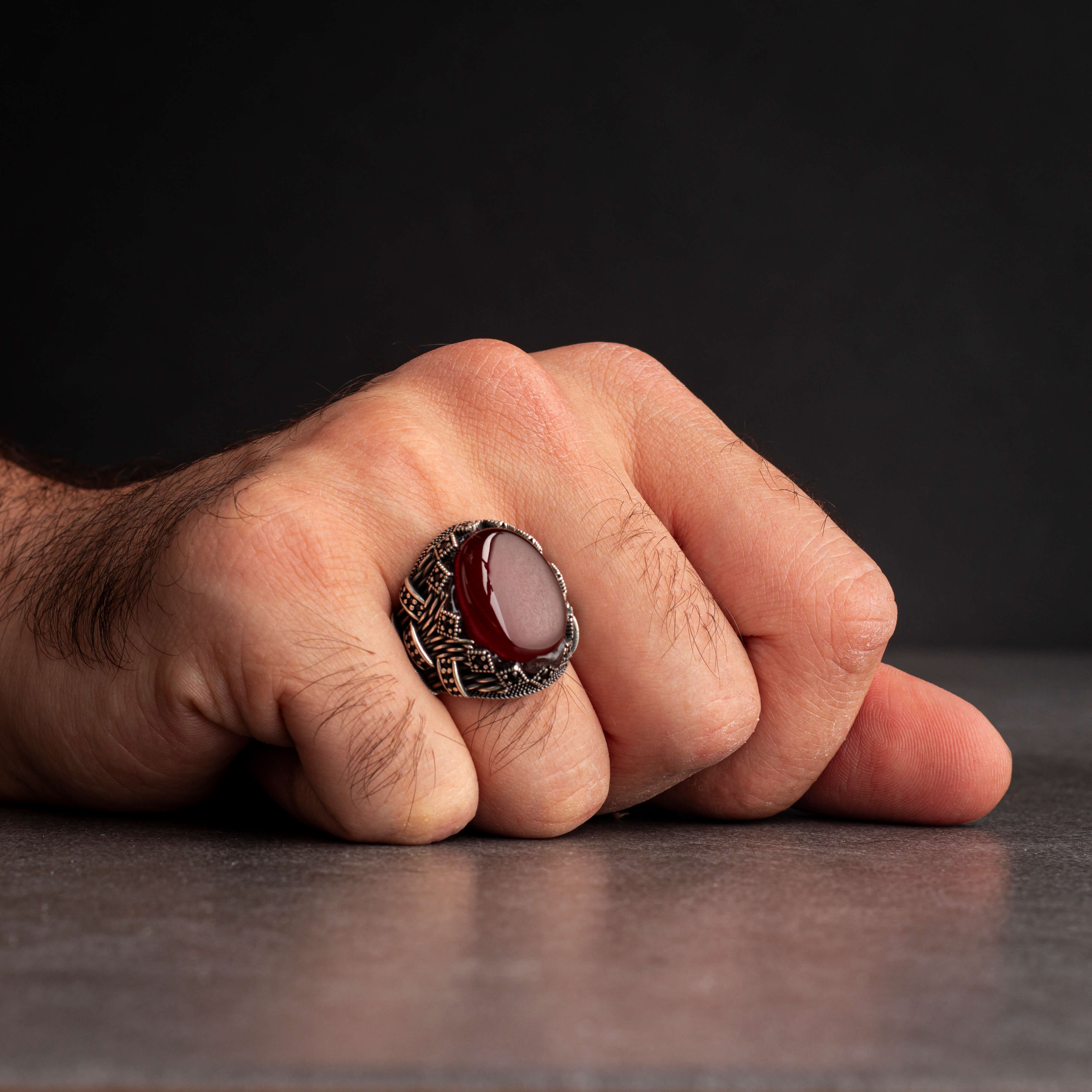 Men's silver ring decorated with red agate stone