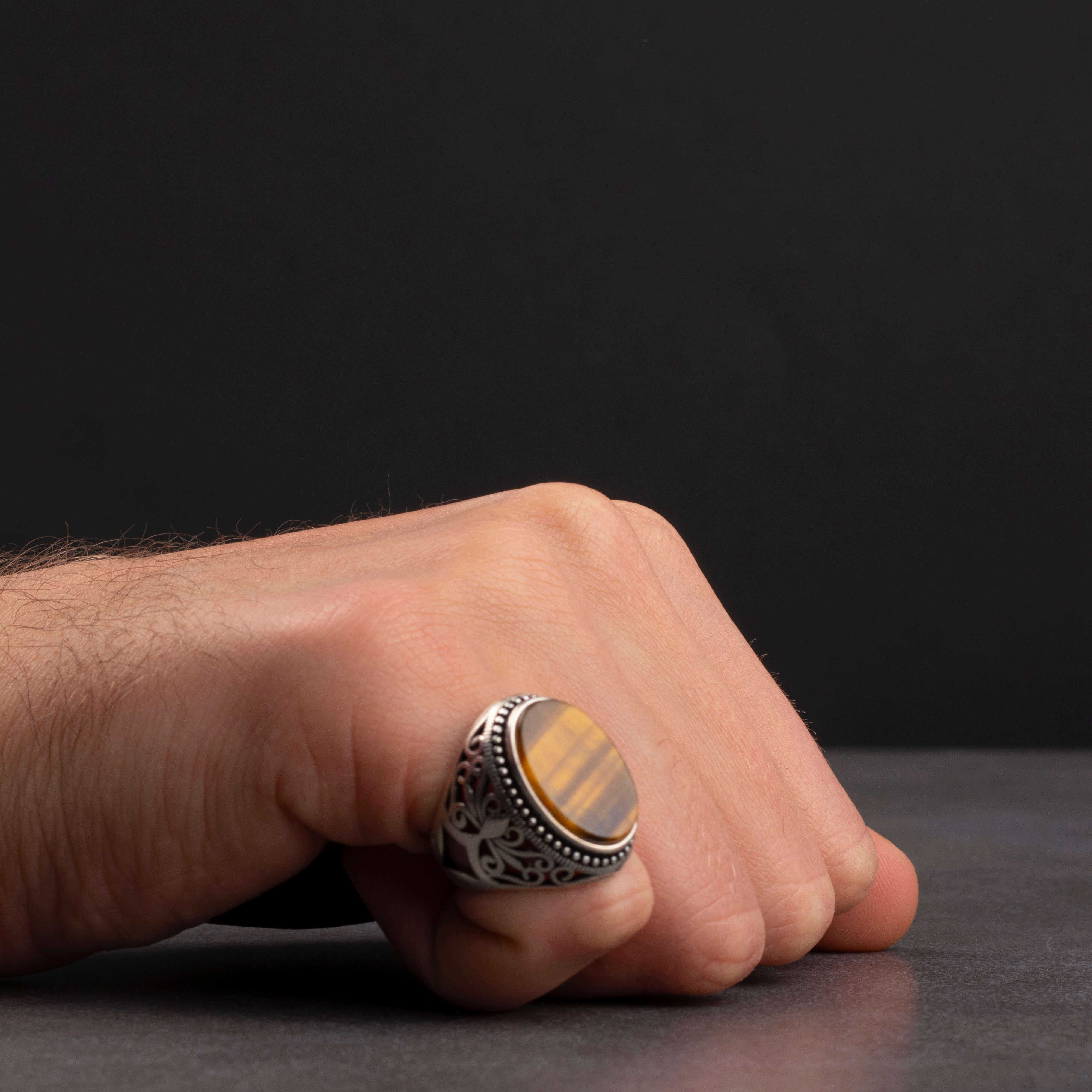 Men's silver ring with tiger eye stone and ornamental design