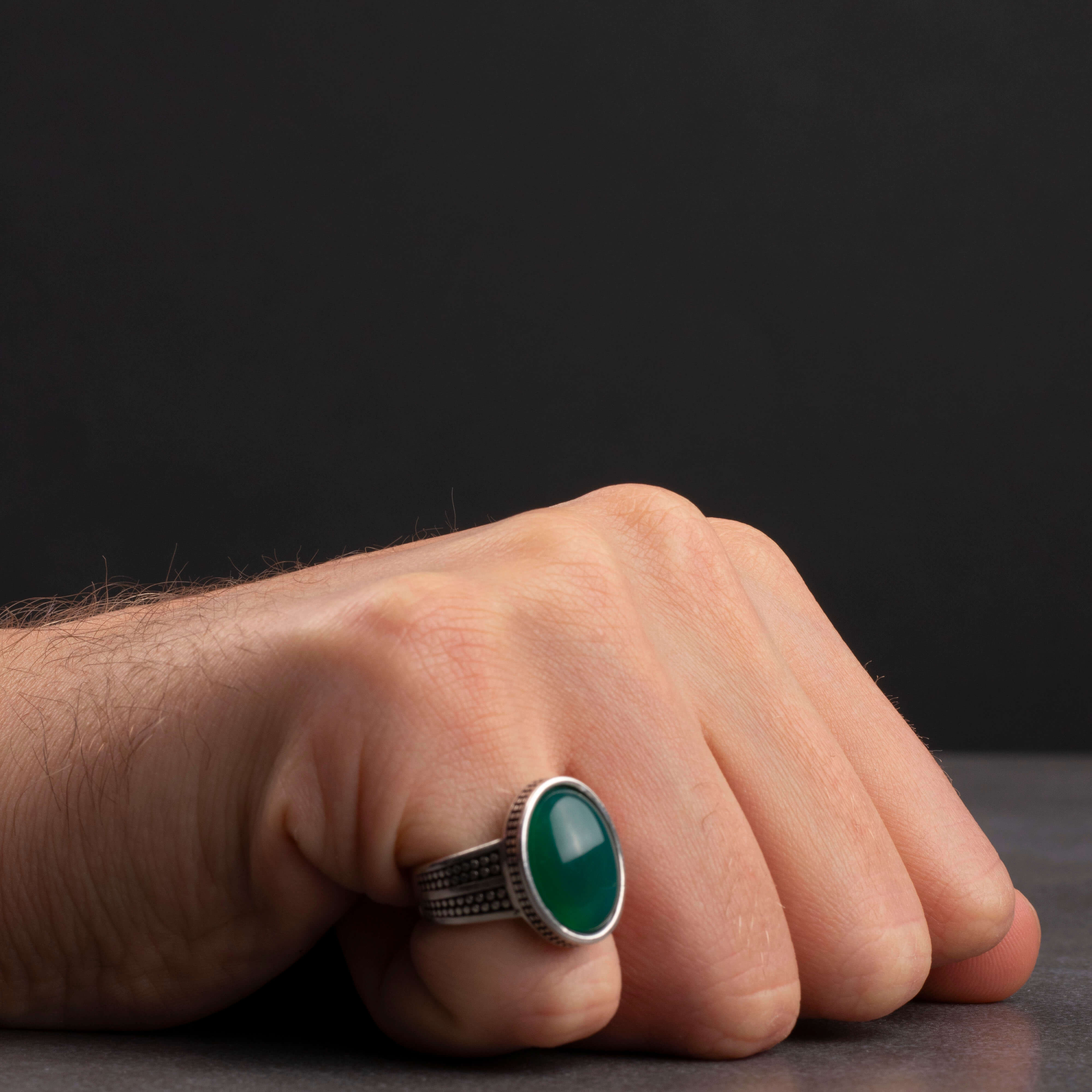 Men's silver ring decorated with green agate stone