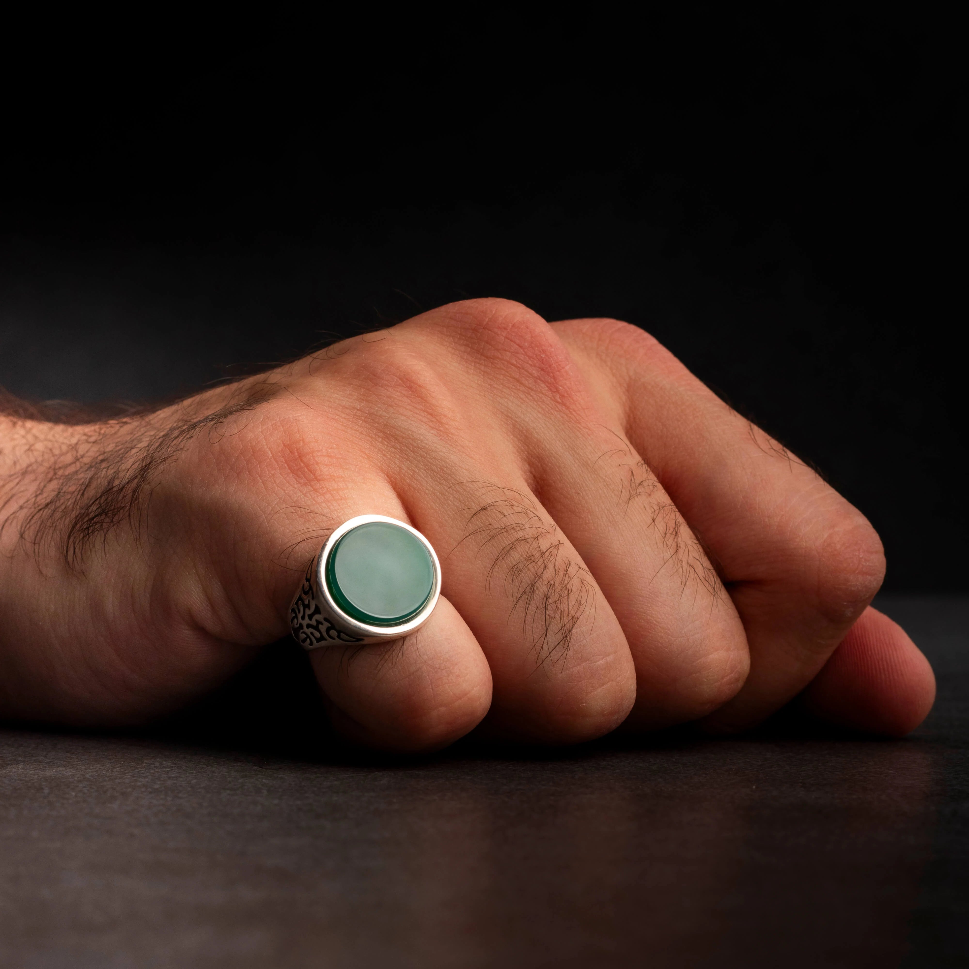 Men's silver ring decorated with green agate stone