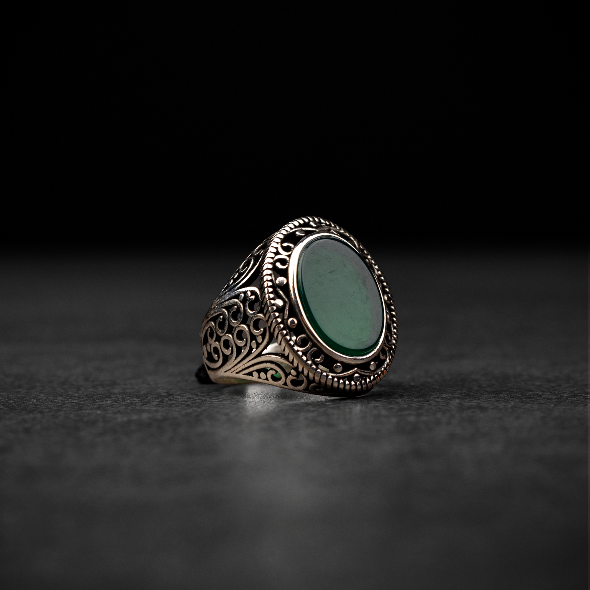 Men's silver ring decorated with green agate stone