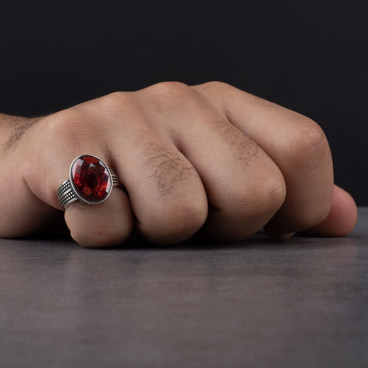 Stylish silver men's ring decorated with red zircon stone