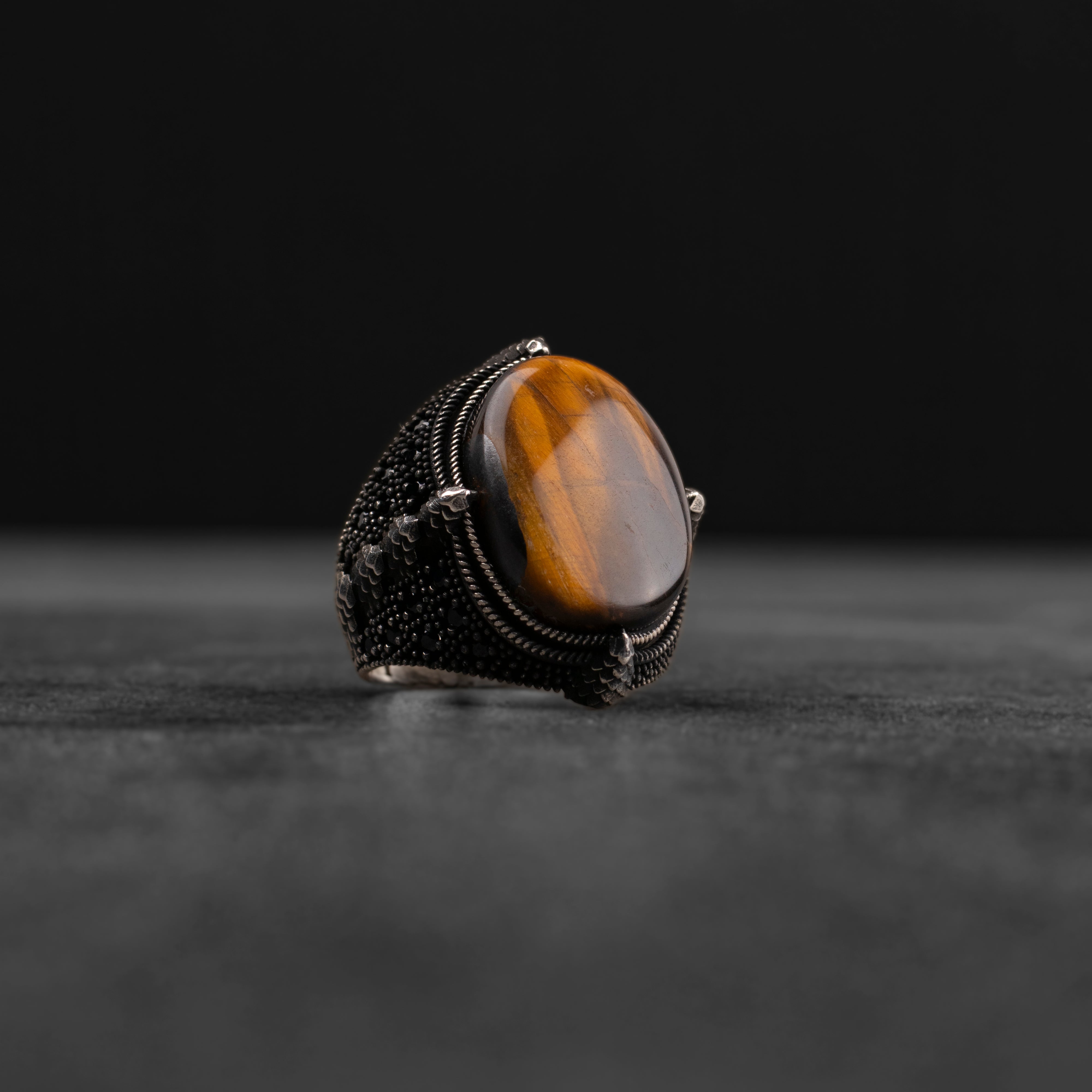 Men's silver ring decorated with a tiger's eye stone