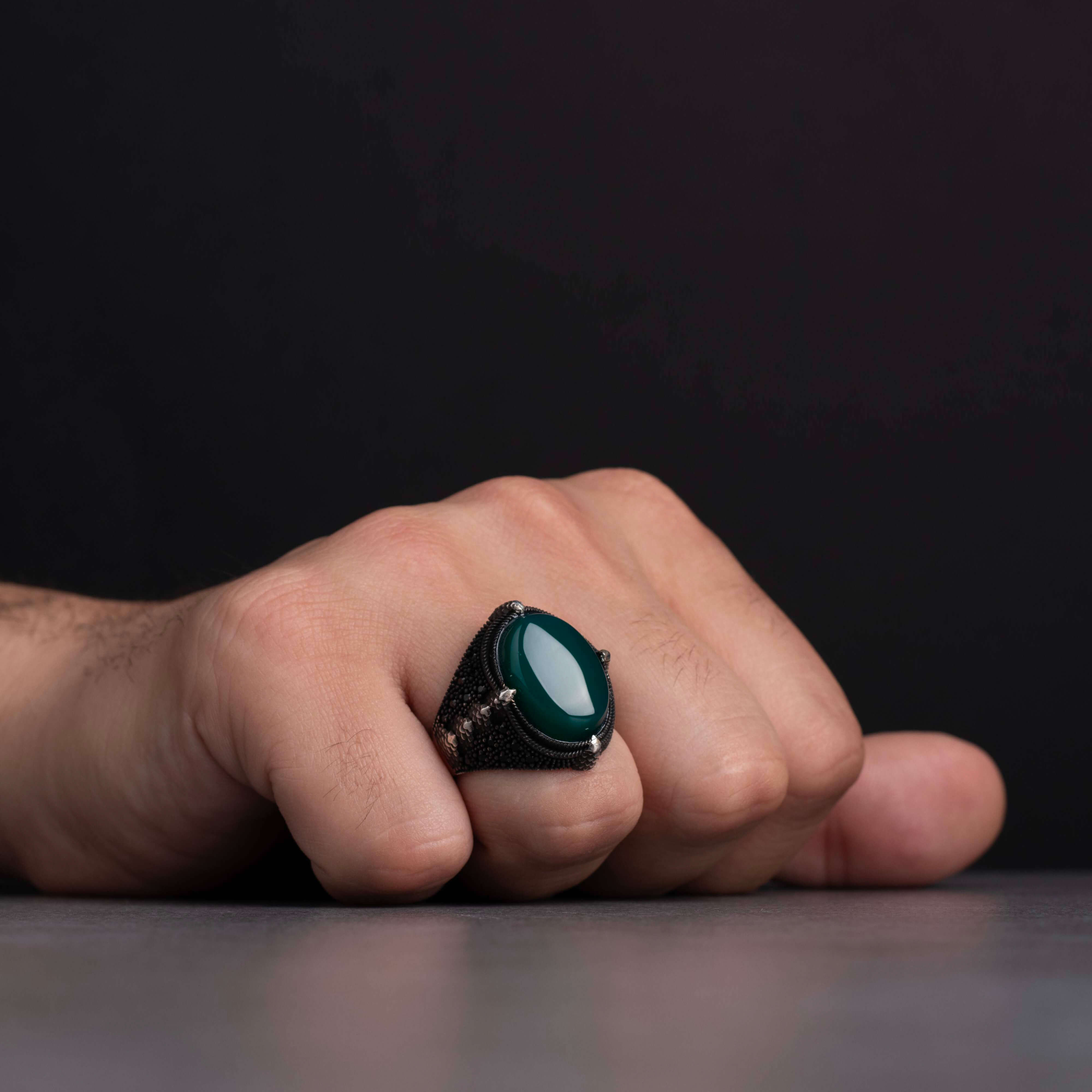 Men's silver ring decorated with green agate stone