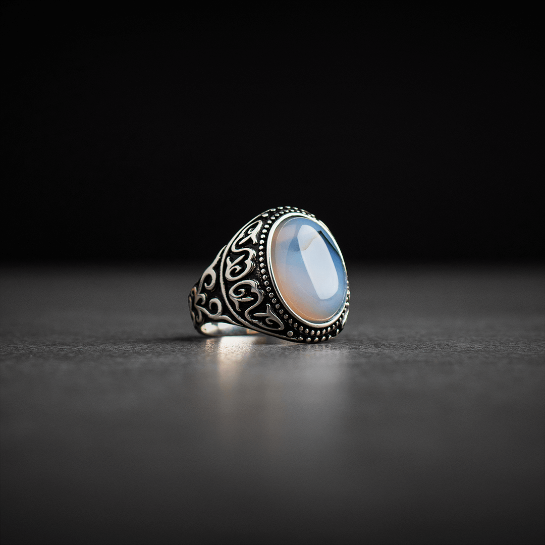 Men's silver ring decorated with a color-changing stone