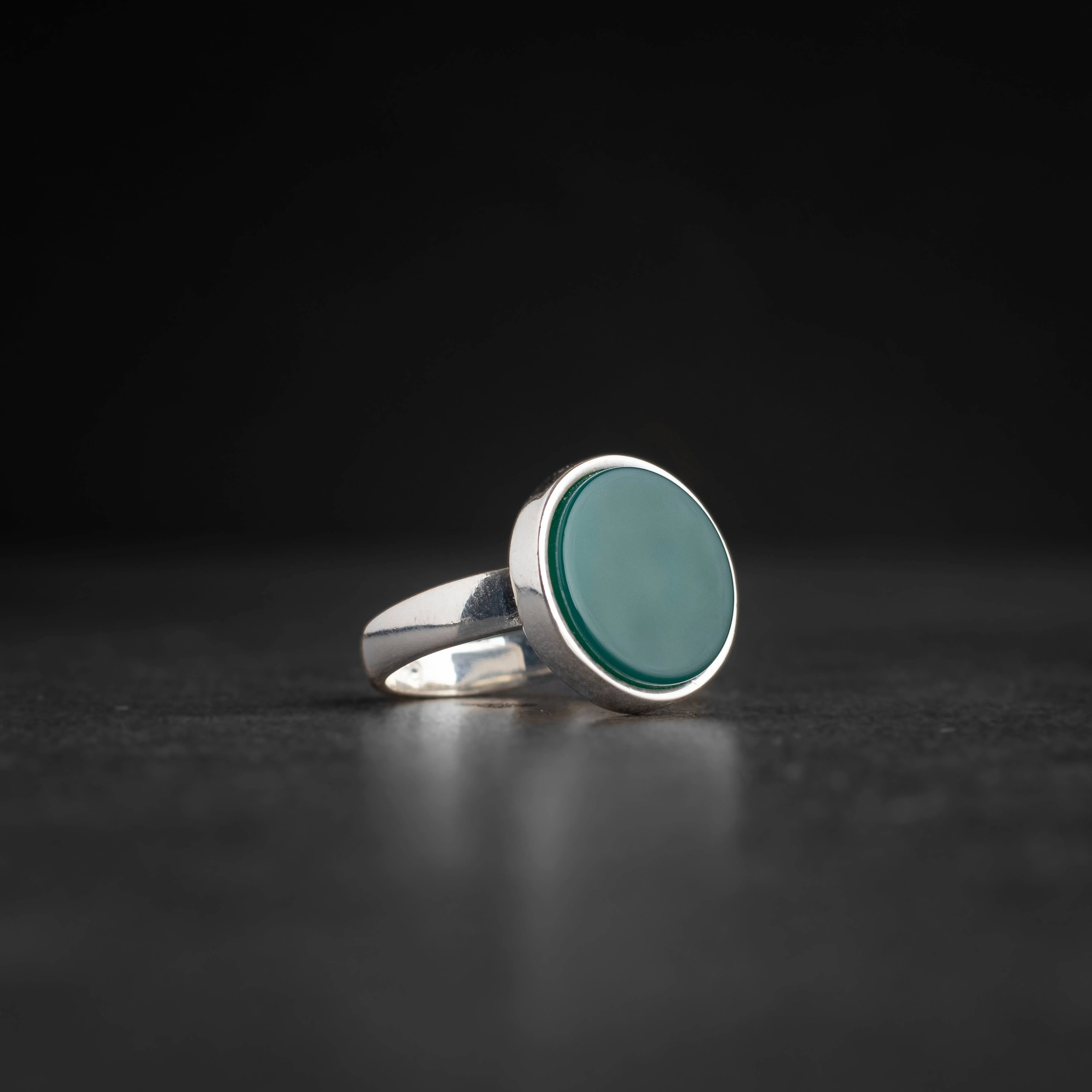 Men's silver ring decorated with green agate stone