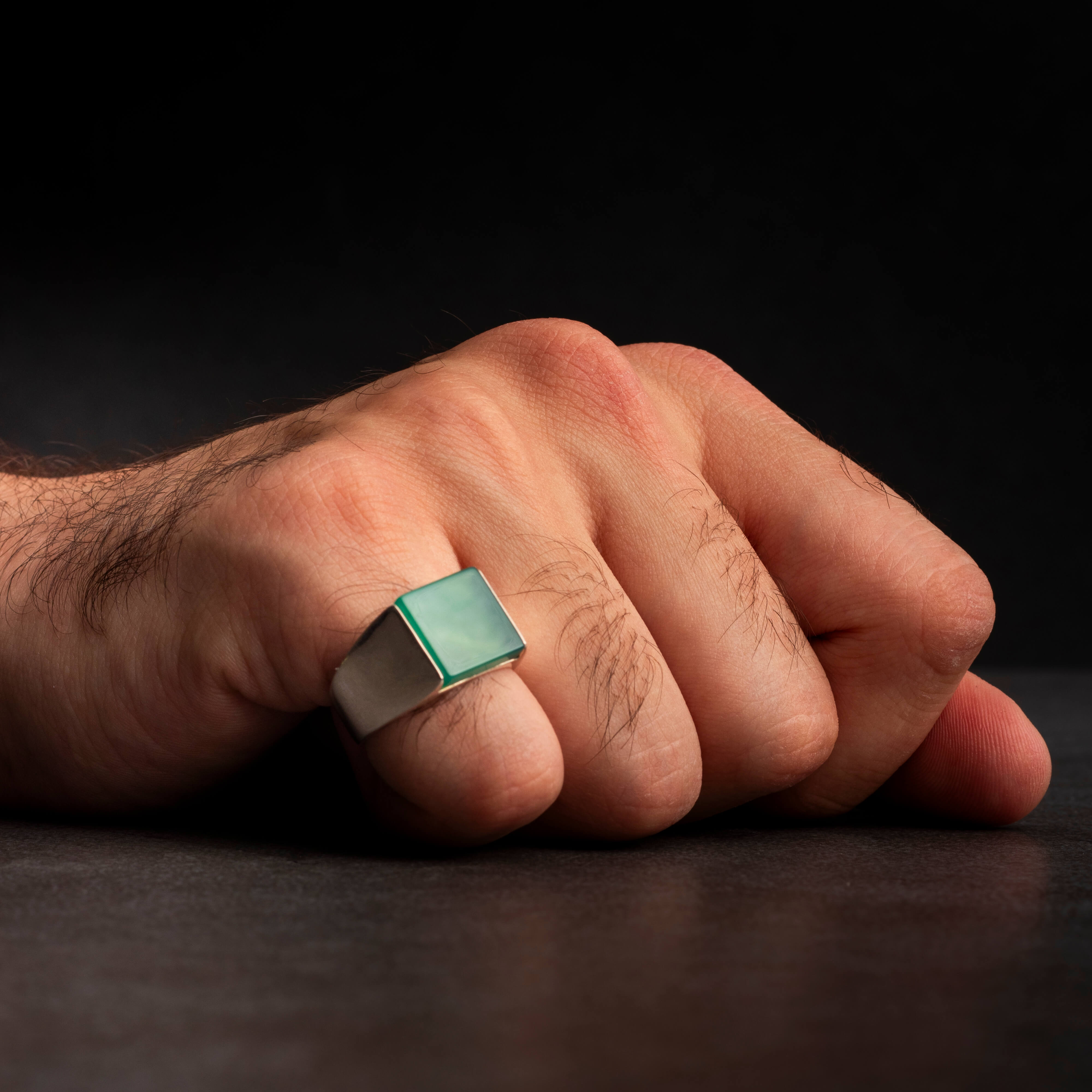 Men's silver ring decorated with green agate stone