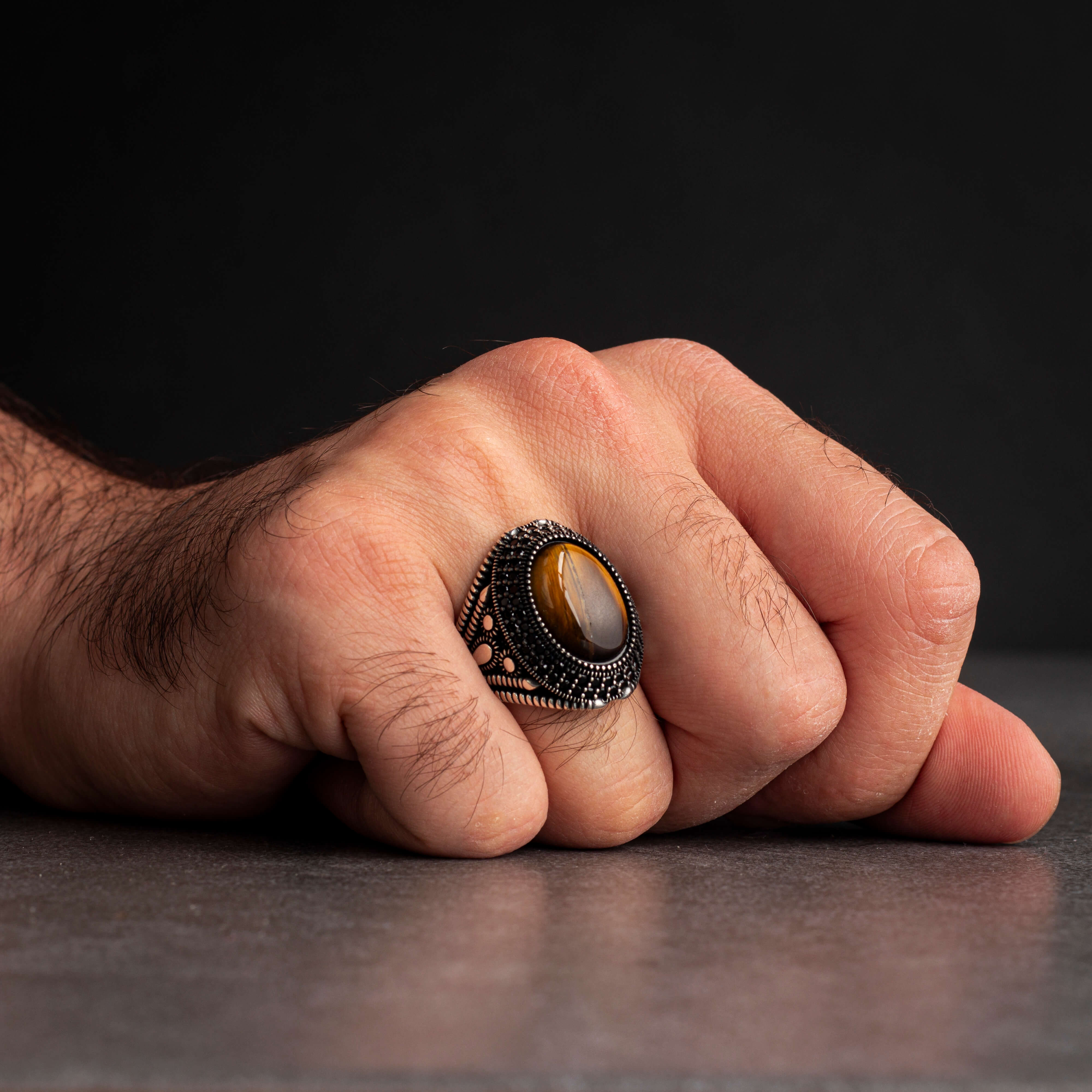 Men's silver ring with a prominent tiger's eye stone, with a luxurious and elegant design