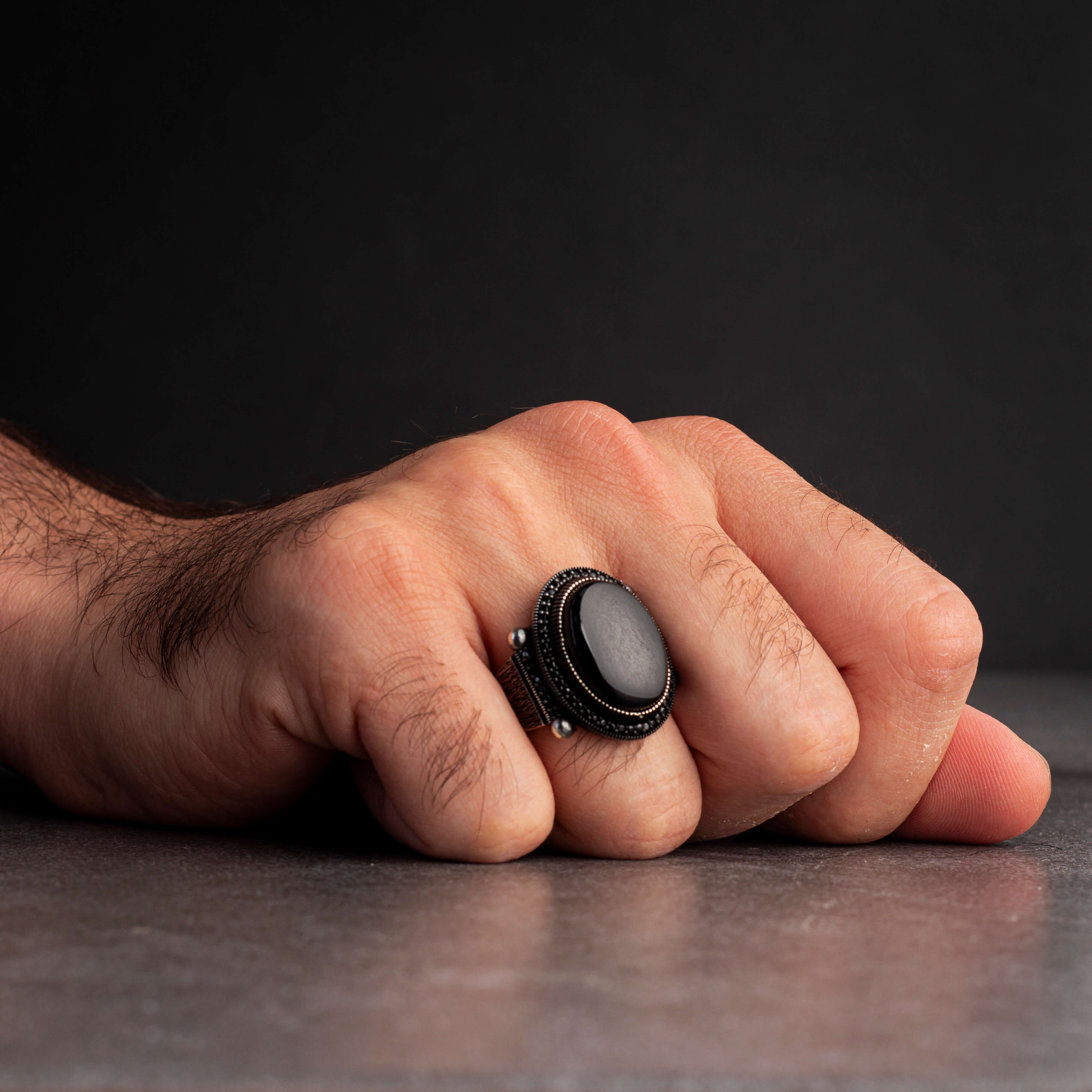 Men's silver ring decorated with black onyx stone