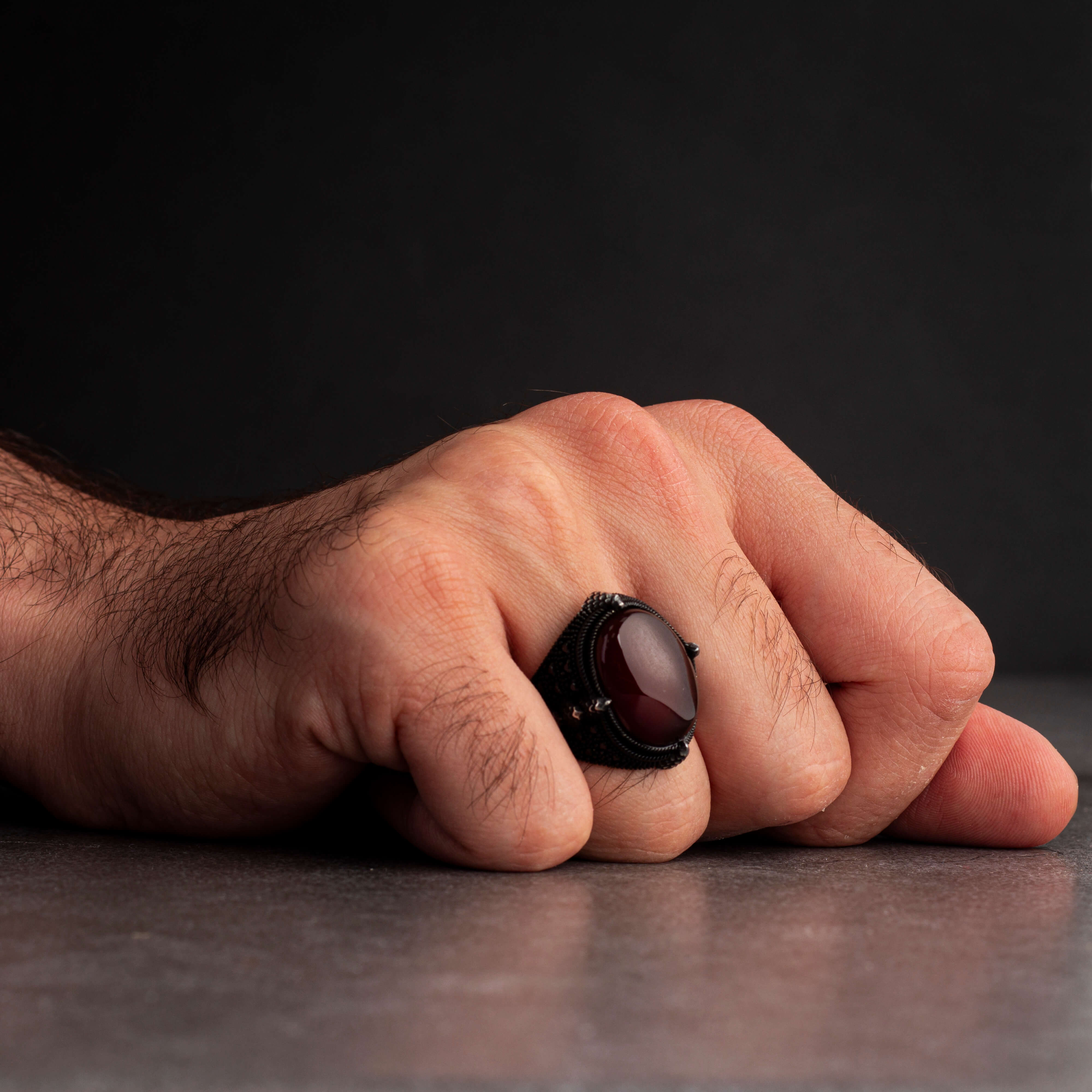 Men's silver ring decorated with red agate stone