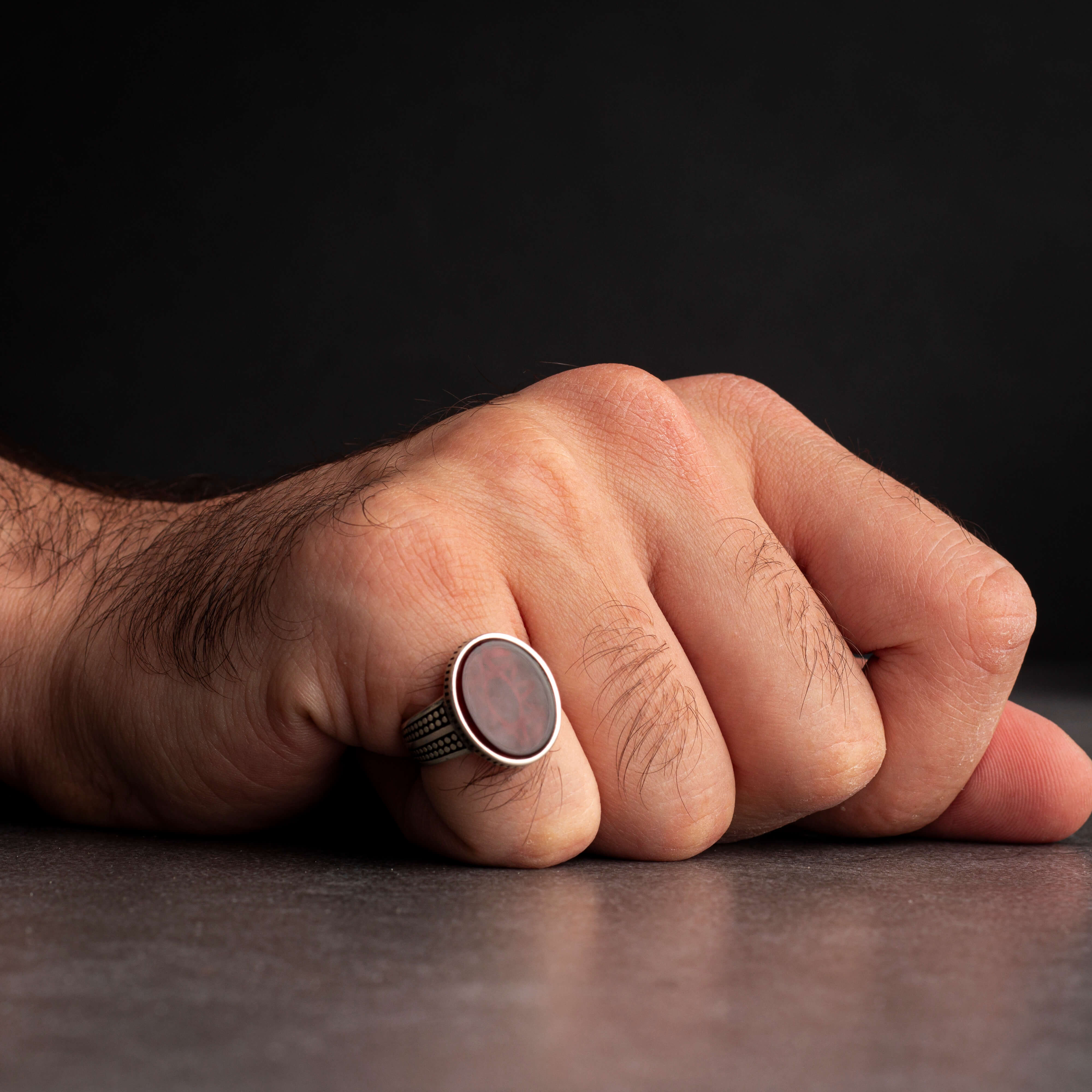Men's silver ring decorated with red agate stone