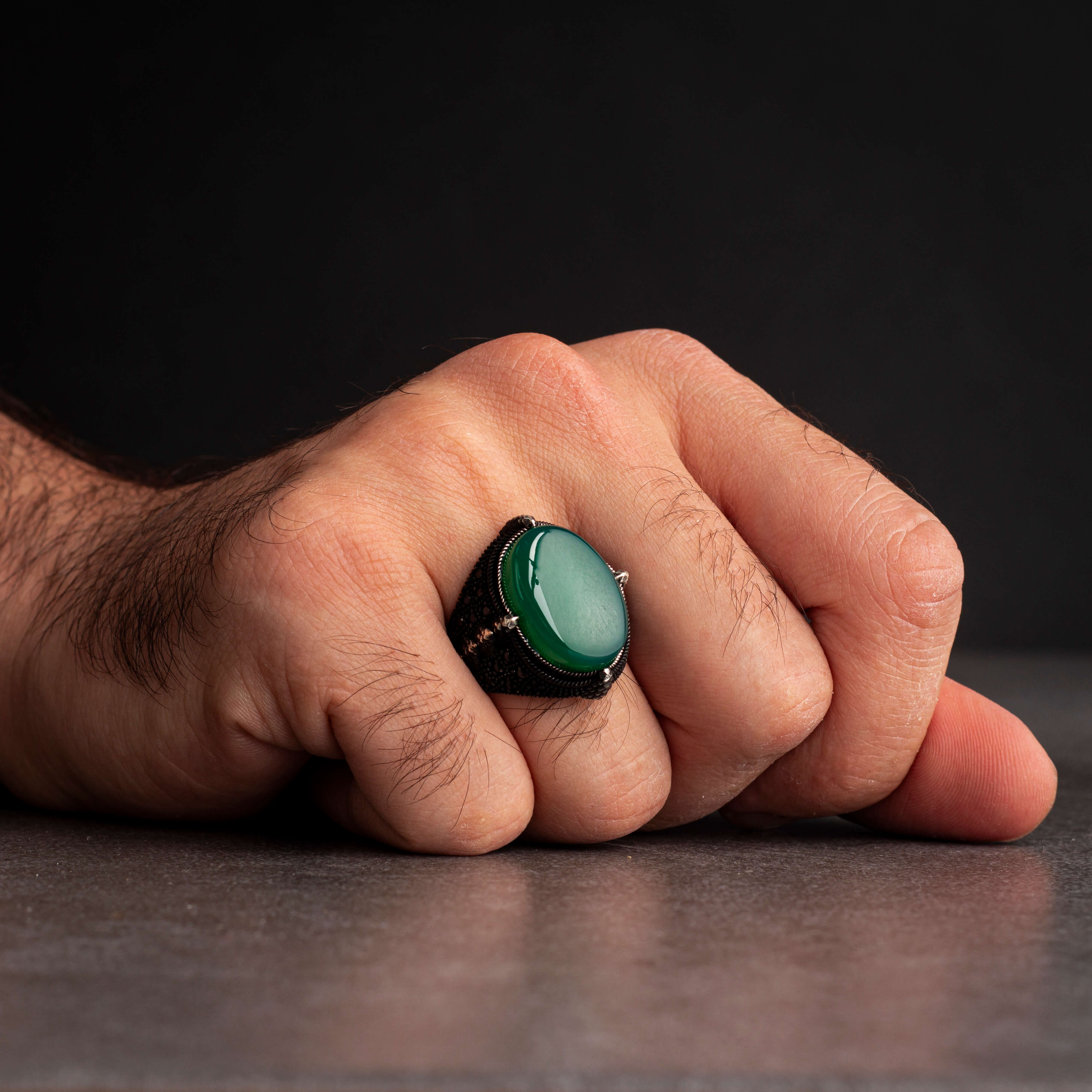 Men's silver ring decorated with green agate stone