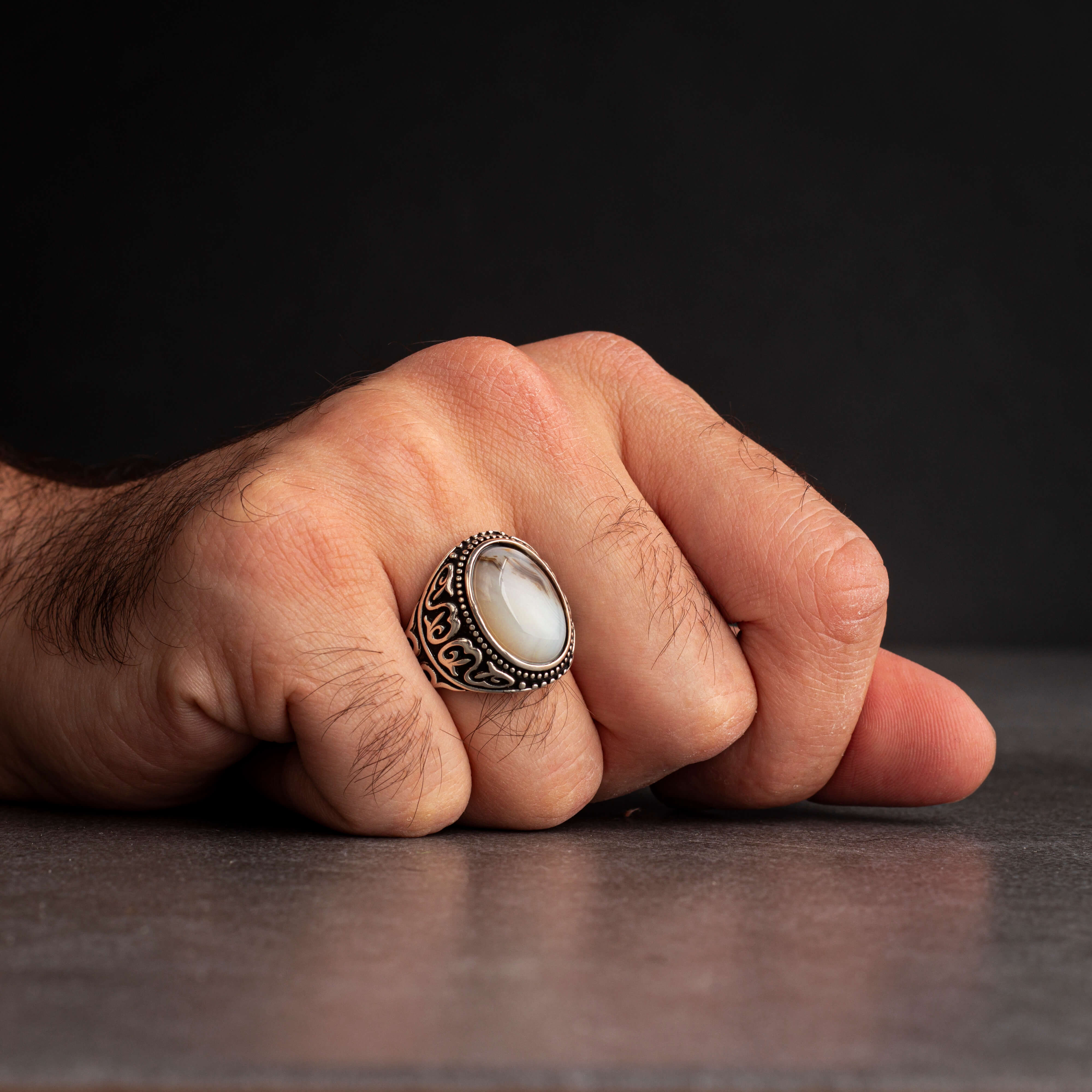 Men's silver ring decorated with a color-changing stone
