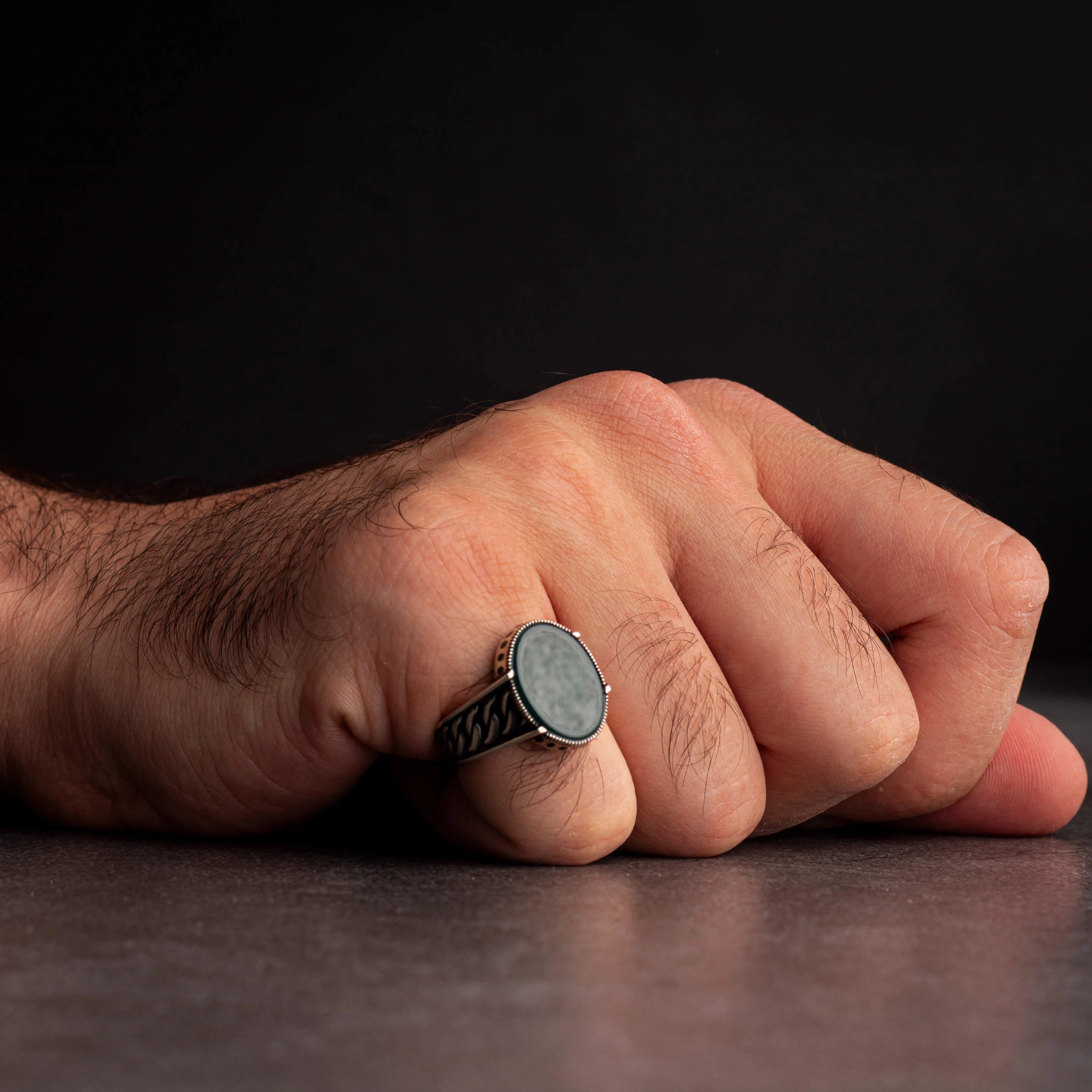 Men's silver ring decorated with green agate stone