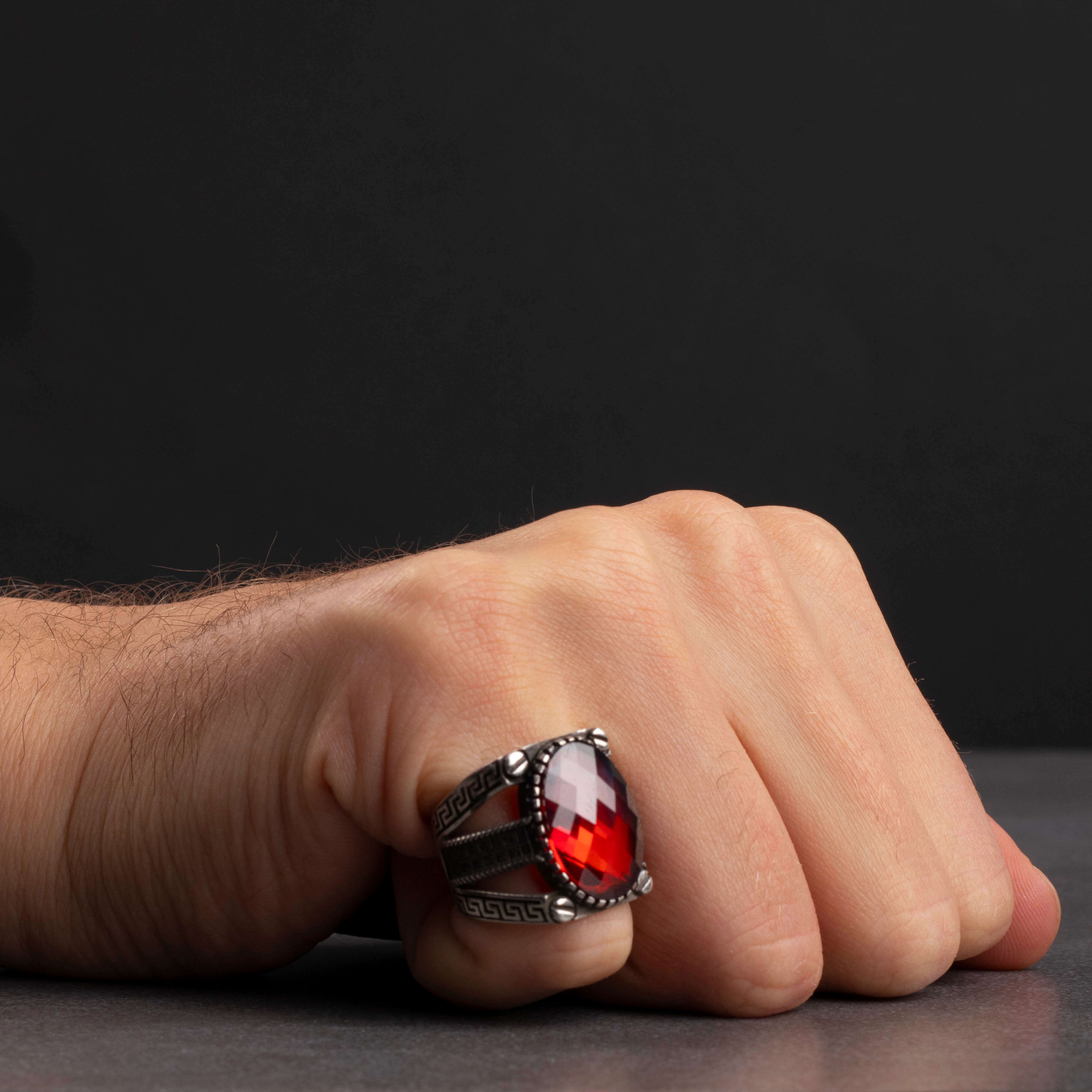 Men's silver ring decorated with red zircon stone