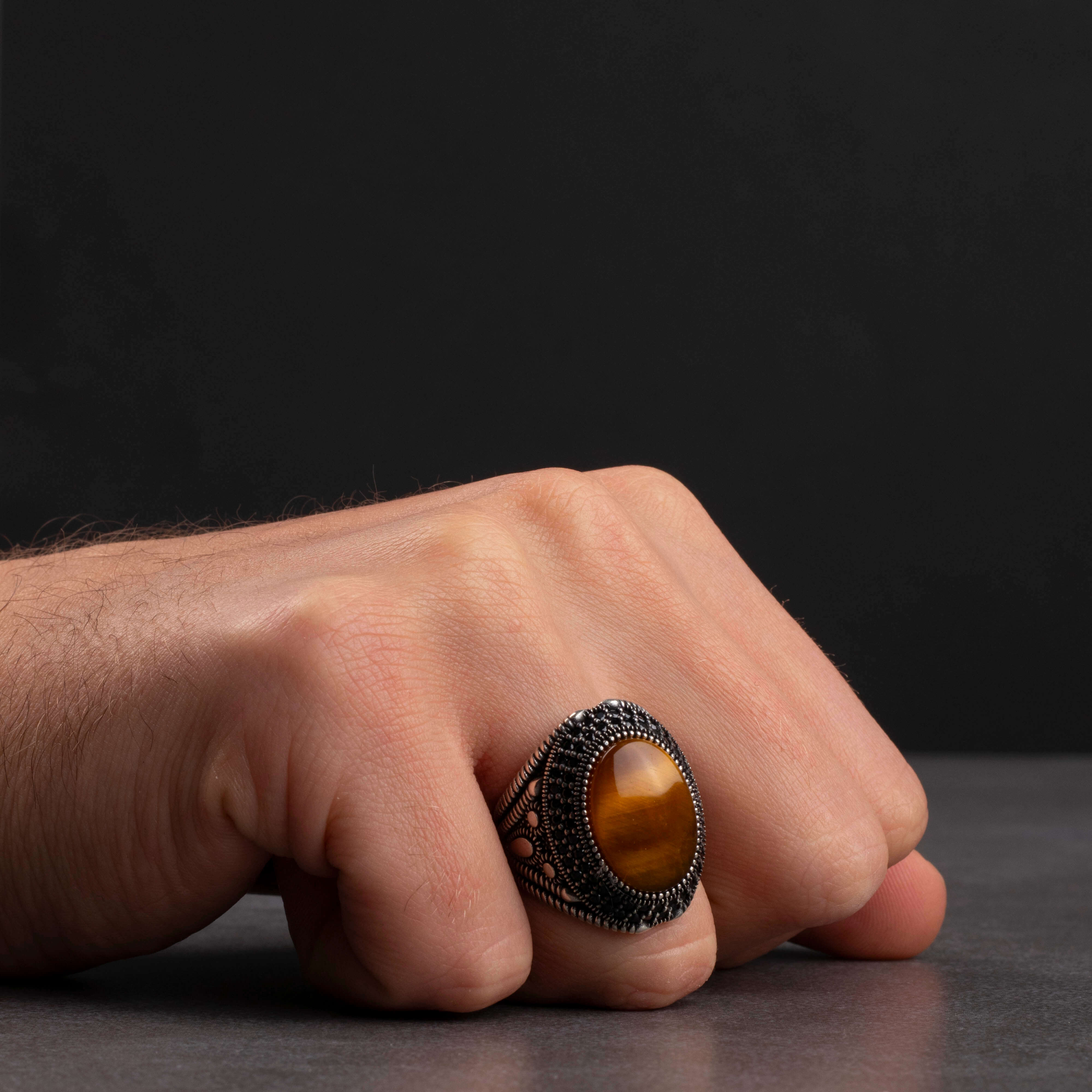 Men's silver ring with a prominent tiger's eye stone, with a luxurious and elegant design