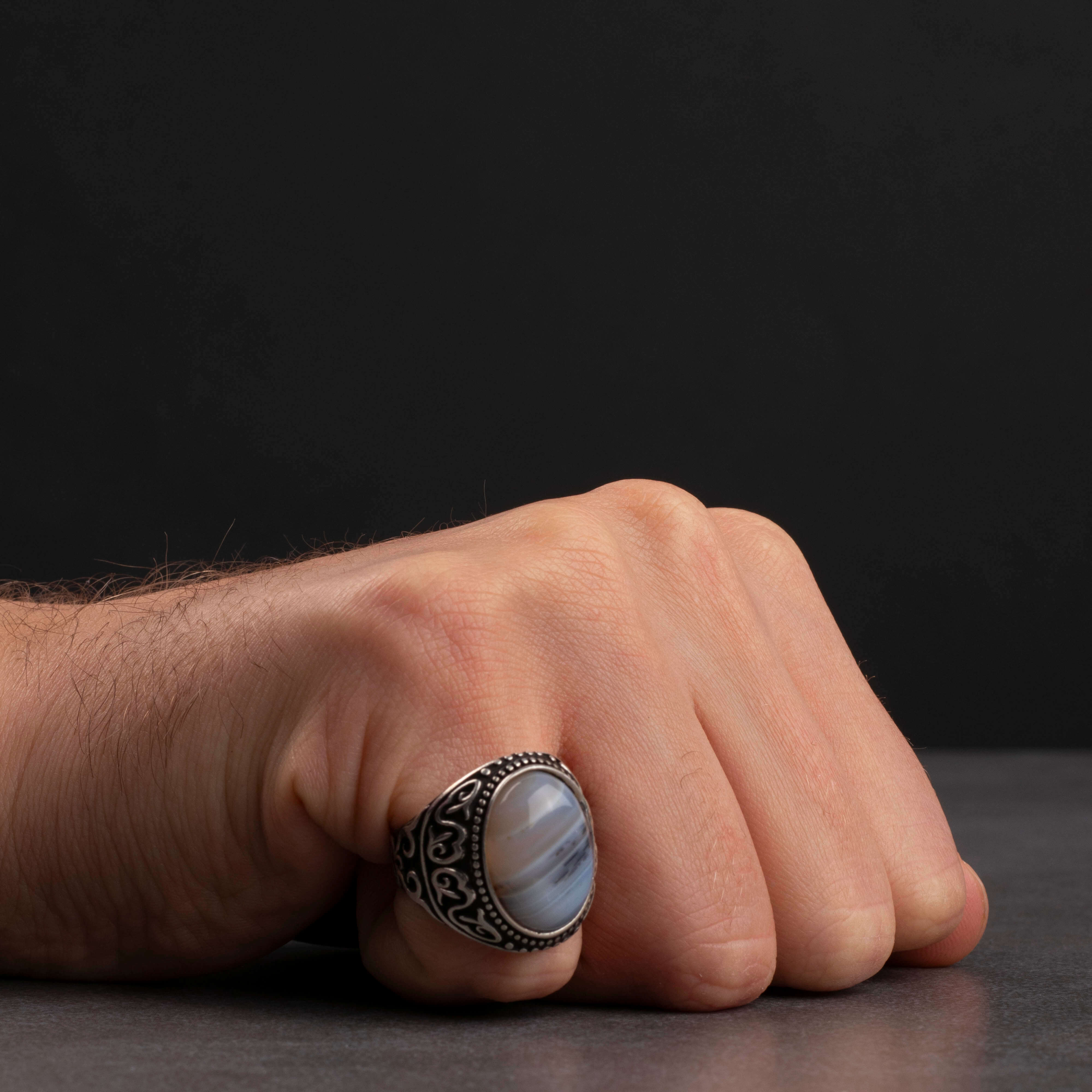 Men's silver ring decorated with a color-changing stone